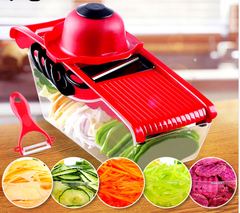 Multifunction 6 Blades Kitchen Slicer in red with sliced vegetables and included peeler on a wooden table