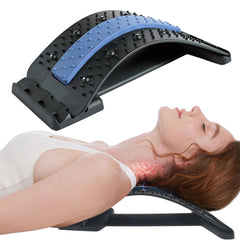 Woman using a black and blue Back Massage Pad to stretch and relieve neck and upper back tension while lying down.