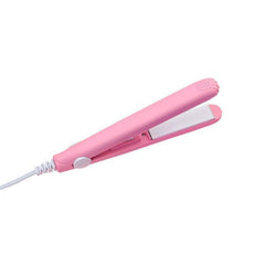 Pink Ceramic Mini Hair Straightener with white heating plates and attached power cord isolated on white background