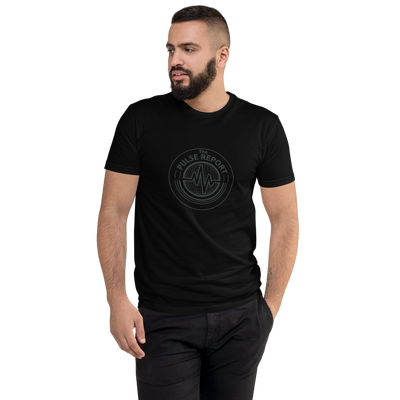 Man wearing a black @ Pulse Report Men's Fitted T-Shirt | Next Level 3600 with graphic design on front, posing with hands in pockets.