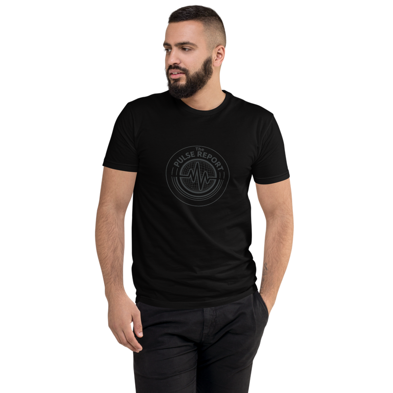 Man wearing a black @ Pulse Report Men's Fitted T-Shirt | Next Level 3600 with graphic design on front, posing with hands in pockets.