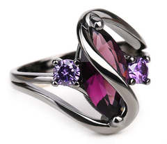 Silver-tone elegant Crystal Ring with a large marquise purple stone and two smaller round purple crystals.