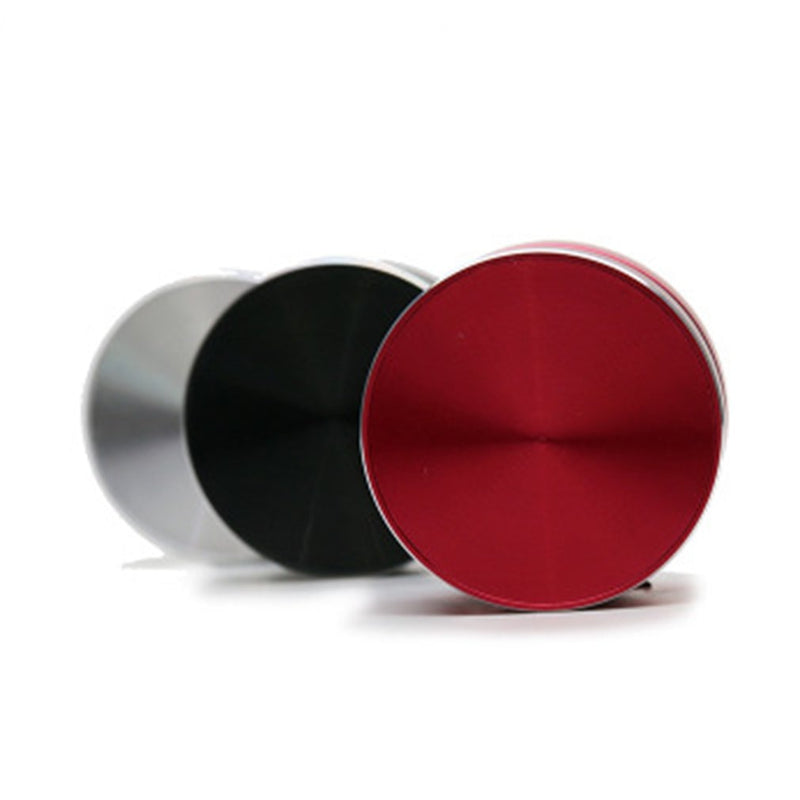 Three Humbird Bone-Conducting Speakers in red, black, and silver with a circular metallic design on white background.