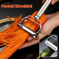Stainless Steel Kitchen Vegetable Peeler peeling and shredding a carrot and cucumber with a sharp blade.