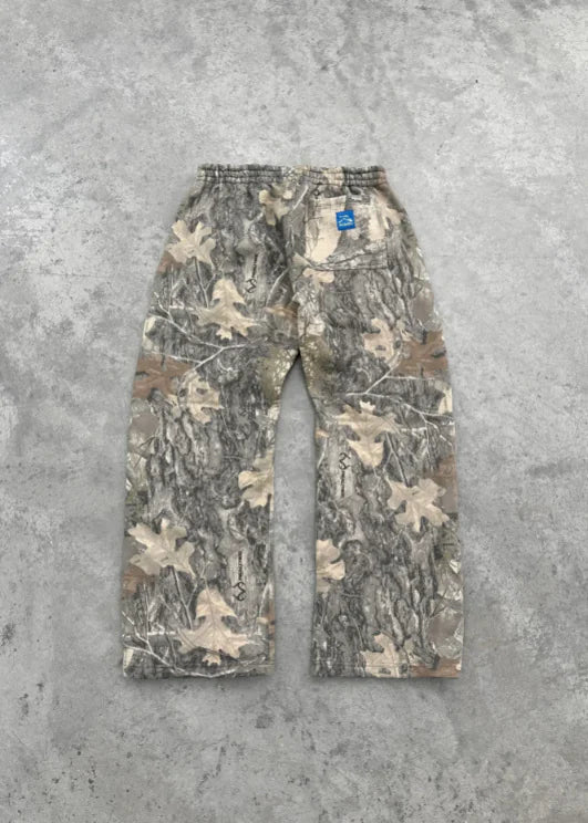 Urban Camo Retro Hoodie with gray and beige camouflage pattern laid flat on a concrete surface