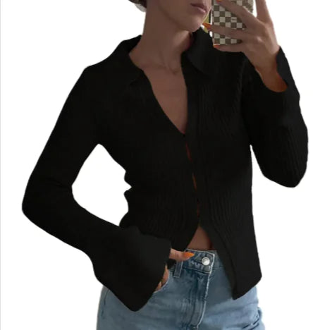 Woman wearing black Bell Sleeve Casual Top paired with light blue jeans taking a mirror selfie with phone