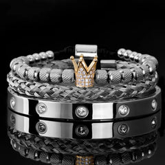 Diamond Roman Bracelets featuring silver and woven metal bands with a gold crown charm encrusted with diamonds.