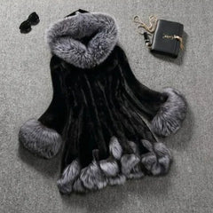 Black Faux Fur Mink Fur Coat with gray fur trim on hood, sleeves, and hem displayed on gray surface