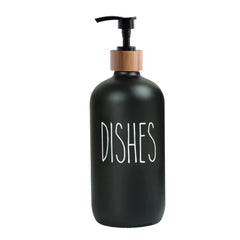 Black soap dispenser bottle with wooden pump labeled dishes on white background next to Kitchen Faucet Mat