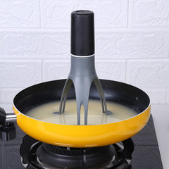 3 Speed Gear Automatic Egg Beaters in use whisking liquid in a yellow frying pan on a stovetop