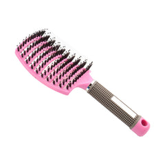 Pink and black Massage Hair Comb with cushioned bristles and ergonomic textured handle for comfortable grip.