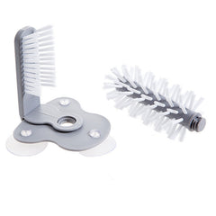 Kitchen Bottle Brush with detachable round bristle head and angled brush attached to a suction base in gray and white.