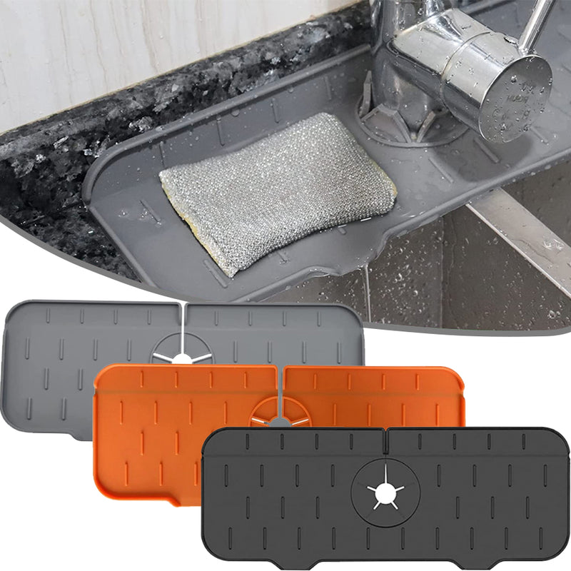 Kitchen Faucet Mat in gray, orange, and black colors placed under sink faucet with a scrubber on top.