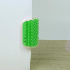Green flexible corner brush mounted on a wall for cats featuring the Cat Self Groomer Corner Brush design.