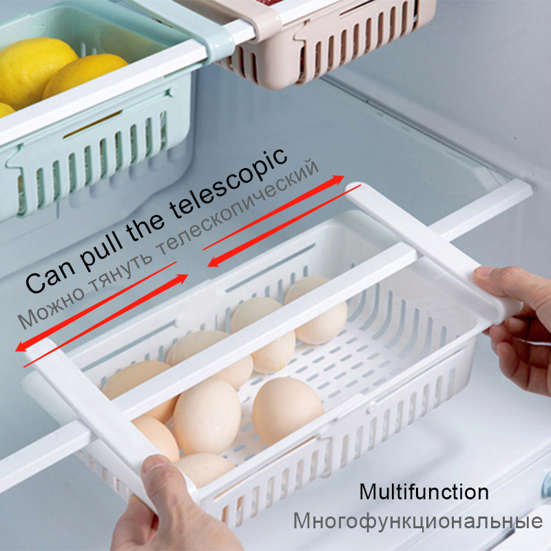 Hands pulling the telescopic white Shelf Kitchen Organizer basket holding eggs inside a refrigerator shelf