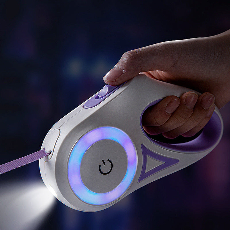 Hand holding a white and purple Led Lights Dog Leash with glowing light ring and built-in flashlight at night.