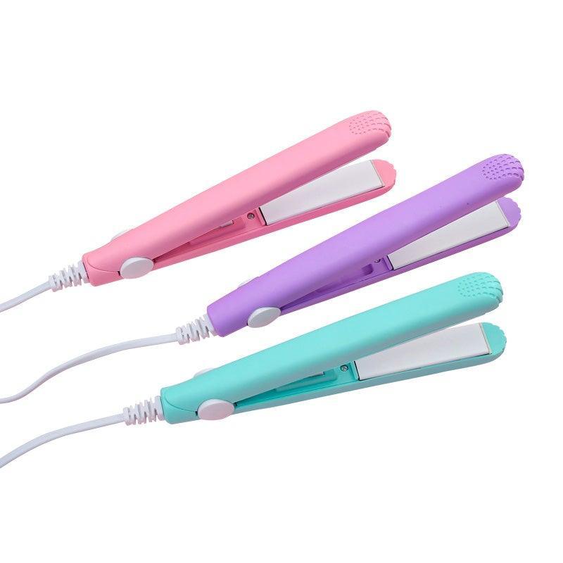 Three colorful Ceramic Mini Hair Straighteners in pink, purple, and teal with white heating plates.