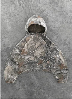 Camouflage Streetwear Hoodie with brown and gray tree branch pattern, long sleeves, and a front pocket on gray background.