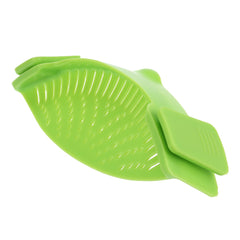 Green silicone kitchen snap n strain filter with flexible slotted design for easy draining and straining.