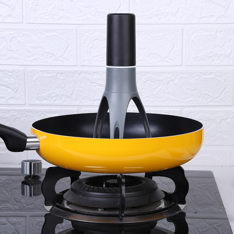 3 Speed Gear Automatic Egg Beaters placed inside a yellow frying pan on a stovetop burner.