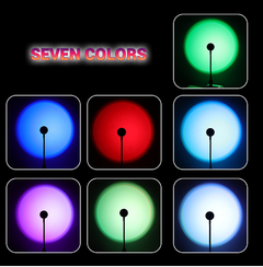 Seven colorful glowing light projections from the Sunset Lamp in different shades including green, blue, red, and purple.