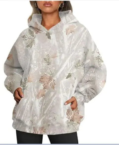 Women's Oversized Camouflage Hoodie with Maple Leaf Print in soft neutral tones and large hood, worn by a model