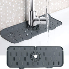 Gray water-resistant Kitchen Faucet Mat placed under faucet to catch drips and prevent countertop damage.