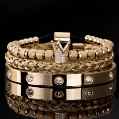Diamond Roman Bracelets featuring gold tones with beaded, braided designs and a crown charm accented with clear diamonds.